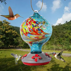 Hand blown glass hummingbird feeder with spiral pattern for outdoor garden hanging